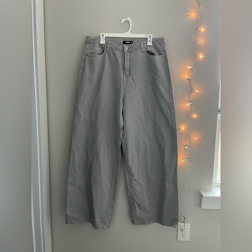 Grey, wide-leg jeans.